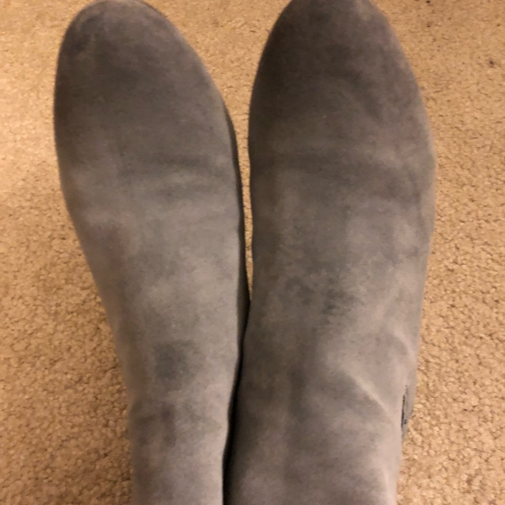 Gray heeled boots.